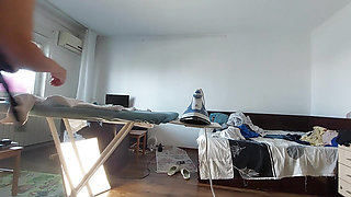 Amateur mom does chores in the naked house.