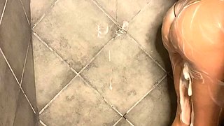 Busty amateur milf masturbates in the shower