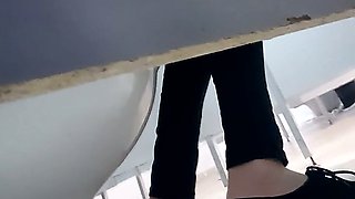 Skinny white chick in black pants filmed in the toilet room