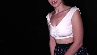 Rebel Rhyder's big tits bounce as she sucks a cock through a gloryhole