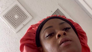 Horny black girl fucks herself with a big cock