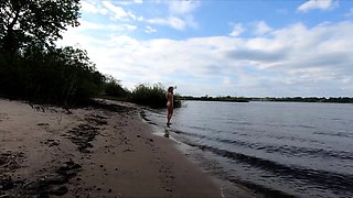 Exhibitionist Blonde Goes Nude on a River Beach