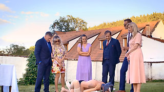 A man in a dog mask is fucking the bride while outside