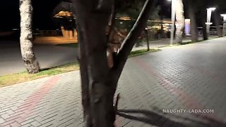 Naughty Lada: Brunette MILF Flashing Pussy in See-Through Dress at Night Bar