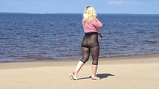 Funny MILF with Nylon Ass and Tits on Beach
