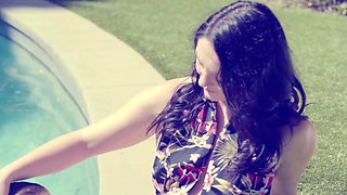 Affectionate vintage scene with Petra Blair and Brad Newman by the pool