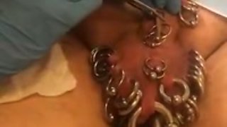 Pierced slavedick getting 5 piercings