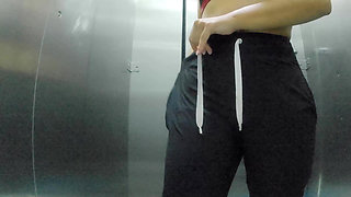 She records herself changing clothes in the bathroom of the shopping center