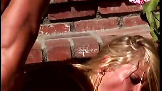Hot blonde sucks a large cock at pool side