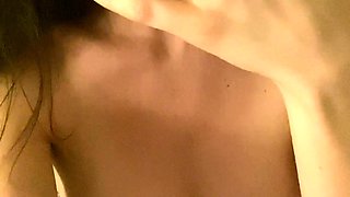 Busty curly brunette with big boobs fucks on couch