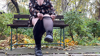 Mature stepmother undresses outdoors