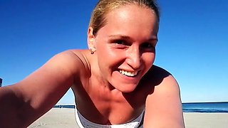 Chick masturbating outdoors on a beach