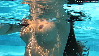 Hot teen Diana in fishnet stockings underwater