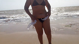 Big ass brunette Latina is very horny and ends up masturbating on the beach, sand and sun