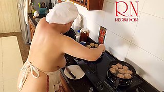 Nudist housewife Regina Noir is cooking in the kitchen