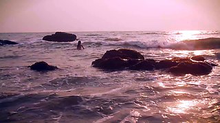 Hot teen stripping seductively and posing naked on the beach