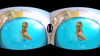 Blonde Enjoys Solo Play In A Pool