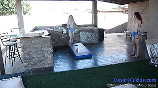 Shey Holmes and two other teens play naked cornhole