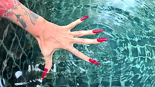 Long Red Nails and Long Fingers in Swimming Pool