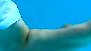 Couple Underwater Diving and Swimming