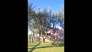 Stepmother in a Bikini in the Garden of the House Makes a Video for Her Stepson, to Show off Her New Clothes.