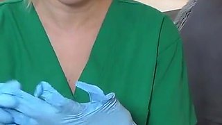 Nurse tries on exam gloves