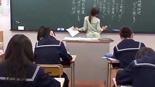Japanese teacher gives a valuable lesson at the blackboard