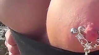Boobs and Pierced Nipples Playing on the Beach