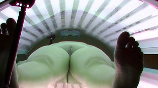 Busty mom in solarium