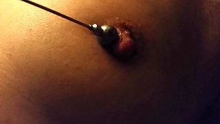nippleringlover milf inserting 16mm bead in extreme stretched nipple piercing
