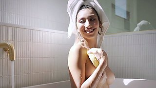 Big tits petite Latina strips in bathtub