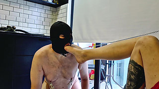 Foot fetish. The slave is allowed to lick feet and suck toes. He receives slaps from the Mistress's feet.