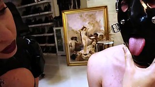 Merciless MILF mistress punishes two pitiful masked slaves