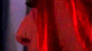 Redhead nurse sucks cock at a gloryhole