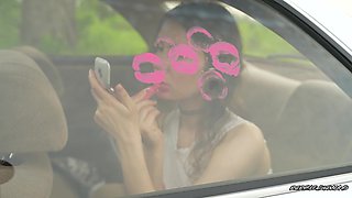 Messy Pink Lipgloss Marks on the Car Window