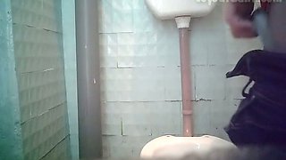 Redhead white amateur chick in the toilet room pissing on cam