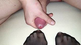 Black nylon sock on Wife's french toenails in detail covered by big cum load