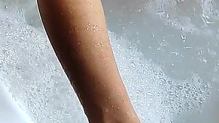 In the Jacuzzi She Starts to Masturbate Me with Her Fantastic Feet