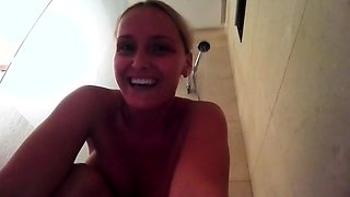 Sensuous stepmother playing with herself in the shower