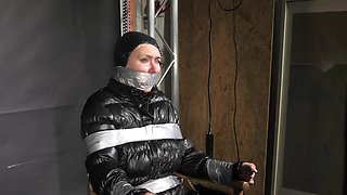 Alice Taped To A Chair And Tapegagged In Shiny Nylon Downjacket