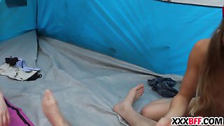 Camping girls sharing a pecker