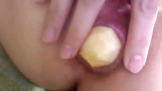 Anal insertion with a cute apple
