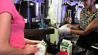 A young and sexy brunette seduced by a lesbian in a shop and dragged in the toilet for fuck