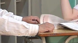 College Girl Stretches Her Legs Under the Desk While Studying and Plays with Teacher's Dick