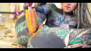 Tattooed girl fingering her pussy and ass