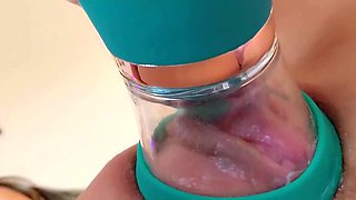 A nice juicy vagina is pleased with a special vacuum masturbator
