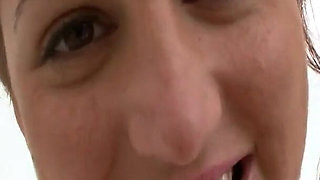 Classy redhead Eden Mor oils up her big natural tits in the bathtub