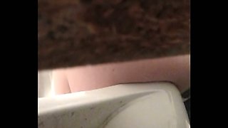 Slender white brunette teen with skinny as filmed from above in the toilet
