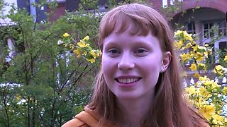Sexy redhead stunner uses a gigantic fake penis for solo