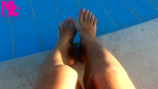 Barefoot Dangling in Swimming Pool Water